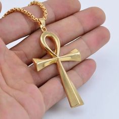 Adorn yourself with the timeless symbol of life and prosperity - our Zinc Alloy Big Ankh Cross Necklace. Crafted with intricate detail and durability in mind, this necklace features a bold representation of the iconic Ankh Cross, a revered emblem from ancient Egypt. The zinc alloy construction ensures both sturdiness and style, allowing you to wear this piece as a striking tribute to the rich heritage and mystique of Egypt. Metals Type: Zinc alloy Chain Type: O-chain We ship worldwide to 185 cou Egypt Necklace, Metal Symbol, Symbol Of Life, Ankh Cross, Ankh Necklace, Crucifix Necklace, Necklace Cross, Life Symbol, Gold Cross Necklace