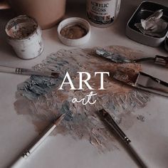 the words art are overlaided with paint brushes and other items on a table