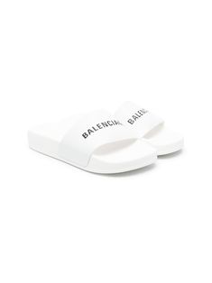 white/black logo print to the front round toe slip-on style flat sole Conscious: We've partnered with Good On You – an ethical agency that rates how sustainably brands perform. This item comes from a brand that performs well in relation to their impact on the planet. Cheap White Slides For Sports, White Luxury Slides, White Non-slip Slide Slippers, White Sporty Synthetic Slides, Balenciaga Fur Slides, Balenciaga Clothes, White Slippers, Balenciaga Logo, Kids Logo