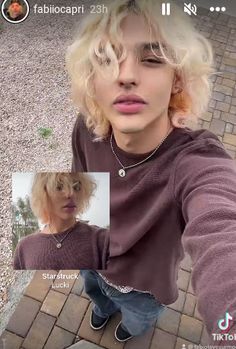 a man with blonde hair is looking at the camera and then taking a selfie