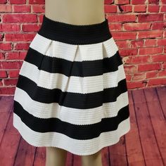 Piace Skirt Black And White Stripe Very Classy Well Made Size Large New With Tags Skirt Is Beautiful With A Formed Flare. Versatile With Boots, Leggings, Heels. Black And White Is Always In Style! Approximate Measurements Waist Flat - 14" With A Comfortable Stretch To 17" Bottom Flare Flat - 30" Length 18.5" 70% Polyester 30% Spandex Chic Striped Lined Skirt Bottoms, Chic Skirt With Striped Hem And Relaxed Fit, Chic Relaxed Skirt With Striped Hem, Chic Vertical Stripes Skirt For Spring, Spring Striped Flared Skirt, Chic Spring Skirt With Striped Hem, Chic Striped Mini Skirt With Lining, Striped Mini Skirt For Spring, Spring Striped Mini Skirt