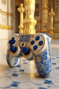 a video game controller sitting on top of a tiled floor next to a golden statue