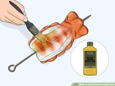 a person holding a glass with liquid in it and an orange substance on the side