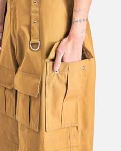 VETEMENTS Multipocket Cargo Pants in Beige. These pants features paneled construction, a zip fly and button closure, four-pocket styling, D-ring straps on the front and back and cargo pockets on the front and sides of the pant. Bao Bao Issey Miyake, Craig Green, Boris Bidjan Saberi, Rick Owens Drkshdw, Pants With Pockets, Raf Simons, Mm6 Maison Margiela, Yohji Yamamoto, Pocket Pants