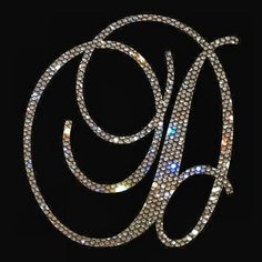 the monogrammed letter g is made up of diamonds