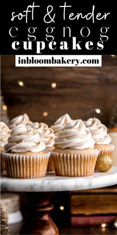 cupcakes with white frosting and gold sprinkles on a cake plate