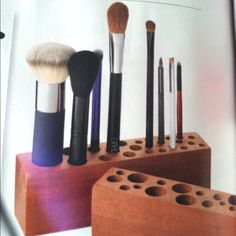 an open magazine with makeup brushes in it