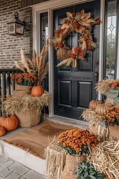 fall front porch decorations with pumpkins and hay