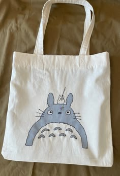 My Neighbor Totoro Tote Bag Size: 40x40cm/ 15.5x15.5in Material: Cotton Toy Inside:Cotton Handmade painted and embroidered bag Perfect for shopping, daily use, students Advice: Colors may be different between monitors All the products are handmade may be 1-2cm variation --------------------------------------------------------------------- Size: 40x40cm/ 15.5x15.5 in Material: Raw cotton denim Lining: Cotton Handcrafted, painted and hand embroidered Perfect for shopping, daily use or carrying stu Cheap Casual Shoulder Bag With Cute Design, Cheap Cartoon Style Bags For Everyday Use, Cheap Cartoon Style Everyday Bags, Cheap Shoulder Bags With Graphic Print, Cheap Trendy Shoulder Bag With Graphic Print, Cheap Shoulder Bag With Graphic Print, Cheap Artsy Bag, Cheap Hand Painted Shoulder Bag For Everyday Use, Tout Bag Ideas