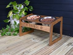 two bowls of dog food on a wooden table