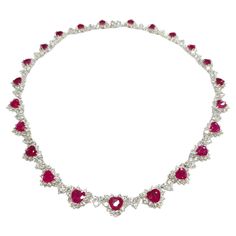 Prepare to make a statement with this breathtaking IGI certified 26.58ct Ruby & 17.85ct Natural Diamonds Necklace in 18K White Gold. Crafted with exquisite artistry and attention to detail, this extraordinary piece is a true masterpiece that showcases the mesmerizing beauty of rubies and diamonds. The focal point of this necklace is the 23 heart-shaped natural rubies, totaling 26.58 carats, each exuding a deep red hue that is synonymous with the finest Burmese rubies. Certified by IGI to ensure Luxury Bollywood Ruby Necklaces, Rubies And Diamonds, Ruby And Diamond Necklace, Diamonds Necklace, Mesmerizing Beauty, Ruby Necklace, Ruby Jewelry, Ruby Diamond, Natural Ruby