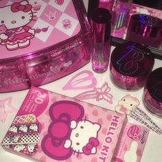 the hello kitty collection is on display in its plastic case and it's pink