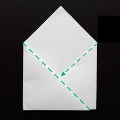 an origami envelope with green lines going through the front and back corner, on a black background