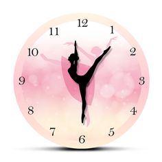 a clock with a ballerina silhouette on it's face and numbers around the clock