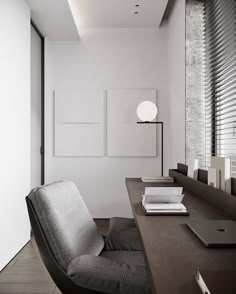 an office with a desk, chair and books on the table in front of it