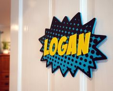 a door sign that says logan on it