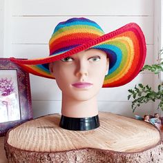 This lovely Rainbow crochet sun hat is handmade and has a malleable wire that has been woven into the rim to help keep the shape. The hat is wide brimmed and provides protection from the sun, so perfect for any summer outdoor activity. Crown size approx. 15cm - Brim size approx. 11cm Daisy hat band is sold separately. Adjustable Multicolor Crochet Straw Hat, Adjustable Multicolor Straw Crochet Hat, Multicolor Yarn Sun Hat For The Beach, Multicolor Yarn Sun Hat For Beach, Multicolor Yarn Sun Hat For Summer, Handmade Curved Brim Sun Hat For Summer, Adjustable Bohemian Crochet Hat For Outdoor, Adjustable Rainbow Hats For Summer, Adjustable Rainbow Summer Hats