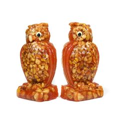 two ceramic owls sitting next to each other