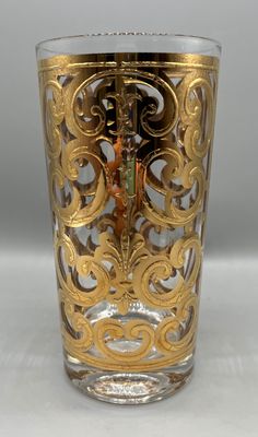 an ornate glass with gold filigrees on it