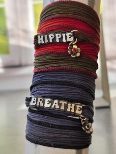 Elevate your yoga practice with our customizable Silk Wrap Bracelet. Handsawed with groovy font letters, choose between "Hippie" with oxblood coral or "Breathe" with London Blue Topaz. You can also Personalize with up to 7 letters and gemstone of choice. Just reach out to us before you purchase. Perfect for yogis, hippies, and bohos. Enhance your style and inner peace. * 925 sterling silver* Silk ribbon* Oxblood Coral & London Blue Topaz* Handmade in our studio in the PNW. This piece will be mad Silk Wrap Bracelets, Font Letters, Groovy Font, Silver Silk, Silk Wrap, London Blue Topaz, London Blue, Silk Ribbon, Lettering Fonts