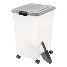 a plastic trash can with wheels and a scoop on the top, in front of a white background