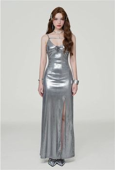 Radiate confidence in our Metallic Sheen Slip Dress, designed for a sleek and bold statement.
Made with a blend of polyester and spandex, this dress offers a comfortable fit with a touch of stretch, perfect for accentuating your silhouette. The thigh-high split adds a flirtatious edge to the elegant shape, while the subtle shimmer of the metallic fabric ensures you stand out in any setting.
Pair this slip dress with strappy heels for a glamorous evening look, or layer it with a tailored blazer f Class Dress, Pose References, Metallic Fabric, Tailored Blazer, Maxi Gowns, Urban Wear, Silver Dress, Strappy Heels, Thigh High