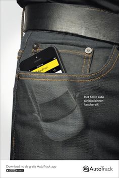 a cell phone sticking out of the back pocket of a pair of dark colored jeans