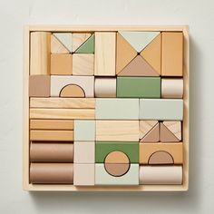 a wooden block set with geometric shapes