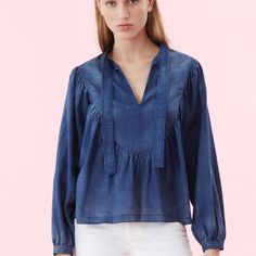 Discover The Most Feminine Way To Wear Denim With This Flowy Top. Its Gauzy, Tissue-Light Cotton Was Developed By A Renowned Mill With An Indigo Wash To Achieve Beautiful Tonal Variations. Thoughtful Details, Including Voluminous Sleeves And A Tie Neckline, Offer An Elevated Take On The Everyday Top. Model Is A Size Small. Height 5'10 Hits At Low Hip 24 1/2" Inches From High Point Shoulder 100% Cotton Hand Wash Cold, Do Not Bleach, Lay Flat To Dry, Low Iron If Needed Pullover Style Chambray Denim Top For Fall, Casual Medium Wash Blouse, Relaxed Fit Denim Blue Blouse For Spring, Chic Relaxed Fit Light Wash Denim Top, Spring Relaxed Fit Denim Blue Blouse, Chic Light Wash Relaxed Fit Denim Top, Casual Cotton Blouse With Frayed Hem, Chic Dark Wash Cotton Tops, Denim Blue Cotton Top With Frayed Hem