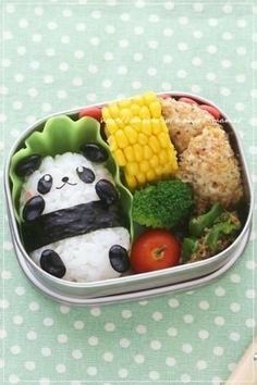 a bento box filled with rice and vegetables