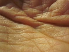 close up view of the skin on someone's hand