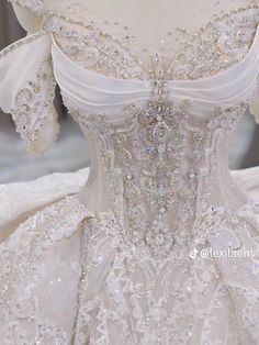 the back of a wedding dress with beading on it