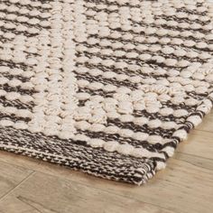 a brown and white rug on the floor