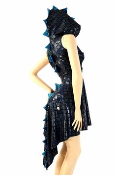 a mannequin wearing a blue dress with spikes on it