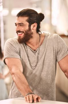 a man with long hair and beard smiling