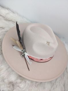 Neutral hat with a pop of the cutest pink bandana band wide brim fedora hat.   This hat is perfect for any cowgirl, country concert, girls trip or for that special occasion!   This hat has a pink bandana band with some layered ribbon, leather cording, and feather cluster along with the cutest cactus pin! There is custom stitching on the side and top brim for an extra special touch. This is a neutral color hat that can be matched to any outfit. This is a cream colored hat made of a polyblend. Thi Western Pink Hat With Curved Brim, Western Style Pink Hat With Curved Brim, Pink Wide Brim Hat For Rodeo, Pink Adjustable Hat Bands For Summer, Pink Brimmed Hat For Rodeo, Trendy Fedora Hat Bands For Ranch, Pink Curved Brim Hat For Rodeo, Pink Western Felt Hat With Curved Brim, Pink Western Style Felt Hat With Curved Brim