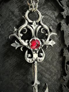 SPECIAL NOTE: This necklace is a new version of the gothic key pendant, so the pictures in the reviews from customers may be different than the actual product, as they have bought the old version of it. The buyer will receive the necklace which is pictured here, if you have any questions, contact me :)This Gothic key necklace is an handmade pewter sculpture with an antique finishThis gothic key necklace is a pendant of 7cmThis Gothic key pendant is a pewter sculpture of my own creation, i create Key Designs, Steampunk Key, Ruby Necklace Pendant, Boys Jewelry, Key Jewelry, Mens Jewelry Necklace, Gothic Necklace, Ruby Pendant, Key Necklace