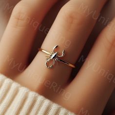 *Free engravings up to 20 characters* Embrace the mystique of the desert with this minimalist scorpion ring! 🌟 It's a bold adornment for your finger or an ideal gift for anyone who finds fascination in the unique and powerful symbolism of scorpions. 🦂💕 This ring is perfect for stacking or making a statement on its own, capturing the essence of the scorpion's resilience and striking presence. Meticulously crafted, it features a minimalist scorpion design along a delicate band, embodying the enigmatic spirit of the desert. Whether you're drawn to the intrigue of these creatures or seeking a distinct piece of jewelry, this scorpion ring is a compelling and edgy choice, ready to accompany you on every daring adventure.  band width: 1.5mm Feel free to message us for customization! We can usu Scorpio Rings, Minimalist Scorpion, Scorpion Jewelry, Desert Jewelry, Fashion Core, Gold Scorpion, Scorpio Ring, Scorpion Ring, Scorpion Design