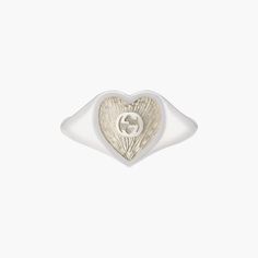 Sterling silver Gucci heart signet ring with white mother-of-pearl enamel. In the center of the Enamel the interlocking G logos is raised. The top of the ring is 0.04" in size. Mother Of Pearl Signet Ring, Gucci White Gold Jewelry For Anniversary, White Engraved Ring Fine Jewelry For Gift, White Engraved Ring As Fine Jewelry Gift, Gucci White Gold Ring In Fine Jewelry Style, White Engraved Ring As Gift, White Gold Gucci Jewelry For Gift, Gucci Fine Jewelry White Gold Rings, White Enamel Rings With Polished Finish