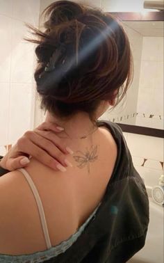 a woman with a tattoo on her back