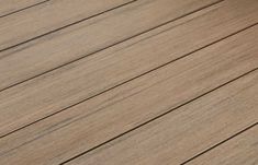 a person riding a skateboard on top of a wooden deck