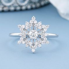 a diamond ring on a blue background