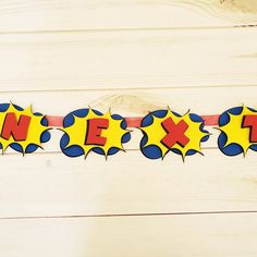 a banner with the word nex on it in red, yellow and blue colors