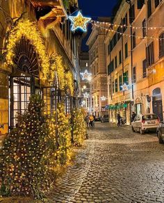 a christmas tree is lit up on the street