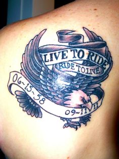 a tattoo on the back of a woman's shoulder that says live to ride