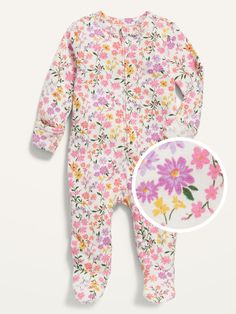 a baby's footie with flowers on it