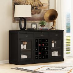 a black cabinet with wine bottles and a hat on top