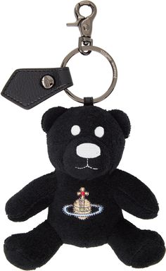 Graphic terrycloth keychain in black. · Keyring and grained leather tab at top · Lobster-clasp fastening · Logo graphic embroidered at face · Logo-engraved silver-tone hardware · H6 x W5 x D1.75 Supplier color: Black Vivienne Westwood Keychain, Teddy Keychain, Black Teddy Bear, Black Keychain, Bag Keychain, Unique Keychains, Face Logo, Silver Engraving, Handbag Wallet