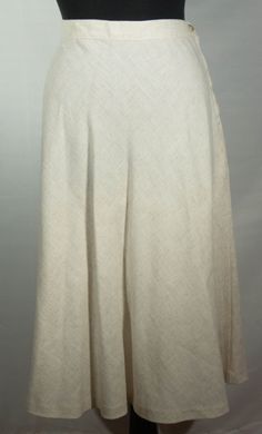 This is a fresh, original and unique rayon, flax and polyester off white, ecru A line boho 1970's vintage Sears label midi skirt. This vintage wardrobe staple, keeper of a neutral skirt is very well constructed. It has a high waist band and hidden zipper and button closure with a hemline that falls below the knees. It also has a wonderful leisure boho 70s look and the great collectible vintage SEARS label. It is in great pre-loved vintage condition with normal signs of wear/use and no major dama Neutral Skirt, Neutral Skirts, 70s Skirt, Chic Natural, Boho 70s, Etiquette Vintage, 70s Look, A Line Cut, Vintage Wardrobe