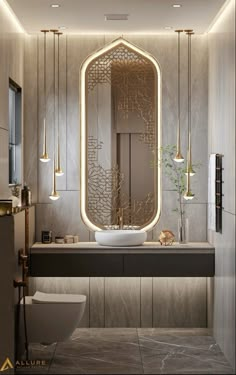 a bathroom with a sink, mirror and lights on the wall next to the toilet